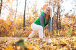 © splitov27 - Beautiful active blonde woman training with medicine ball in autumn forest. Workout outdoor concept