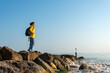 © Rob Wilkinson - woman looking out to sea, hiker with backpack.
