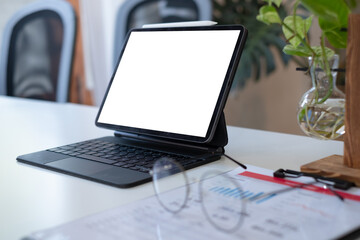 cropped shot of worktable with mock up two laptop, stationery and supplies in co working space