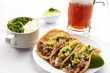 Pork or pork tacos, part that uses the knuckle and corn tortilla, prepared with xalapeño pepper sauce, cilantro and onion