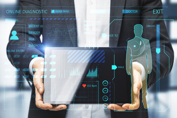 Close up of businessman hands holding tablet with creative glowing medical interface hologram on blurry interior background. Medicine, online technology and future healthcare concept. Double exposure.