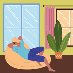 Wall Mural - man relaxing on a bean chair