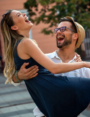 Wall Mural - Portrait of happy couple having date and fun on vacation. People travel happiness concept.