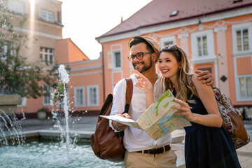 Wall Mural - happy tourist couple in love having fun, traveling smiling together on vacation