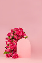 Spring Abstract Stage With Arch - Pink Fresh Spray Roses, Blank Rounded Space As Podium Mockup On Pink Background, Copy Space, Vertical. Template For Presentation Cosmetic, Goods, Advertising, Design.