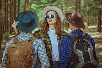 Wall Mural - stylish tourists in a forest