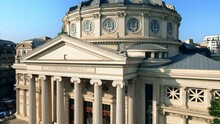 Aerial Drone View Of Romanian Athenaeum In Bucharest, Romania. Main Building Entrance, Multiple Buildings Around
