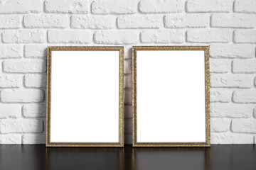 Wall Mural - Blank picture frame against brick wall with copy space