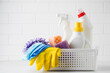  Cleaning products for cleaning, disinfection at home in a basket on a light background. 