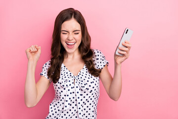 Poster - Photo of funky overjoyed girl raise fists in victory win in social media phone giveaway isolated on pink color background