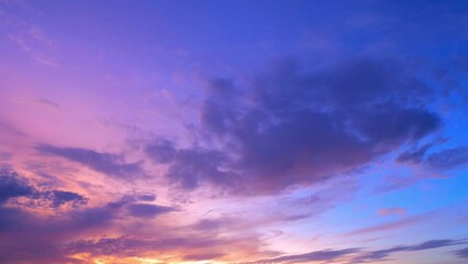 Wall Mural - 4K Sky Time lapse of Colorful clouds during the moving sun. Beautiful cloud space weather beautiful blue sky background.
