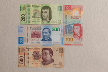 Banknotes Of 500,200,100 And 50 Mexican Pesos, Arranged On A Table, With Copy Space