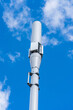Vertical low angle shot of the 4G or 5G Cellular Antenna mast with cloudy sky in the background