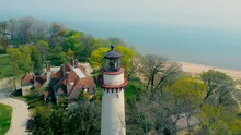 Lighthouse On The Shores Of Lake Michigan. Flying Around The Great Ancient Lighthouse