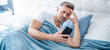 © be free - sleepy mature man in bed chatting on phone