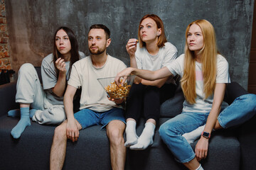 Friends gathered in the apartment to watch the premiere of a new film