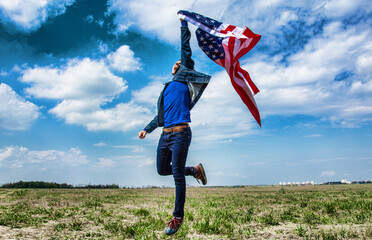 Wall Mural - proud strong  man waving american flag against blue sky. Happy Flag Day, USA united state  background	