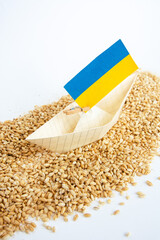 Wall Mural - grain wheat and spikelets on a blue background. Ukrainian grain and problems of blockade of ports.	
