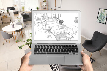 Poster - Designer holding laptop with drawing of new studio apartment interior