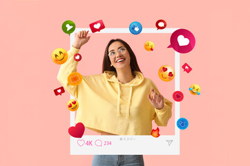 happy young female blogger on pink background