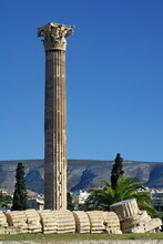 Ancient Column, With A Toppled Column At The Base, In A Park In Athens, Greece