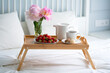 © oldesign - Tray with breakfast on bed.