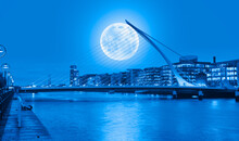 Samuel Backett Bridge (Harp Bridge) At Twilight Blue Hour With Full Moon - River Liffey, Dublin  Ireland "Elements Of This Image Furnished By NASA"