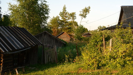 Wall Mural - Beautiful rustic summer landscape. Old wooden log houses. Vologda region