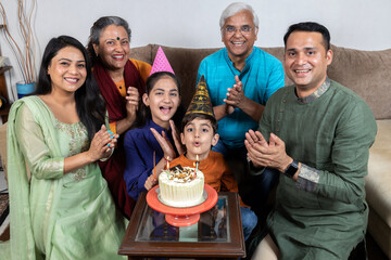 indian family celebrating birthday  at home 