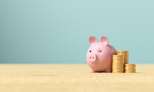 Pink Piggy Bank And A Stack Of Coins On A Wooden Surface. 3d Render Illustration For Business Ideas.
