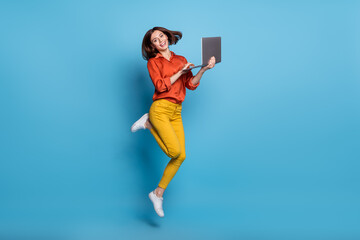 Poster - Full size profile side photo of young excited girl energetic jump use laptop manager isolated over blue color background