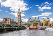 Famous Big Ben With Bridge Over Thames And Tourboat On The River In London, England, UK