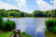 Leinwandbild Motiv Beuerbacher See near Beuerbach. Pond with surrounding nature in Hesse. Landscape at the lake.
