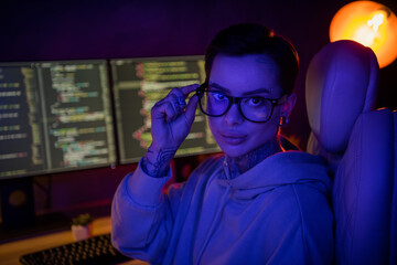 photo of thoughtful busy it specialist dressed sweatshirt piercing glasses debagging program indoors