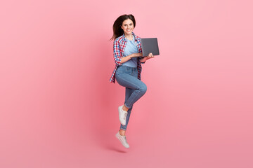 Poster - Full size photo of jumping business lady working on new project in her netbook isolated on pink color background