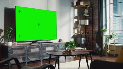 Poster - cozy living room with stylish furniture and design, green chroma key tv in the middle of the room. e