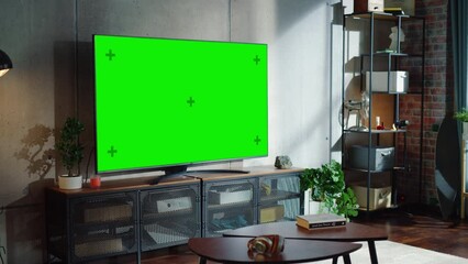 Poster - loft and cozy living room interior with television set with chroma key display, sofa and urban city 