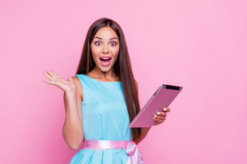 Poster - Photo of cute impressed lady dressed teal outfit reading modern gadget empty space isolated pink color background