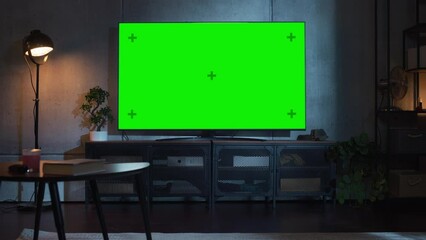 Poster - Zoom Out Shot of TV with Horizontal Green Screen Mock Up. Evening Living Room at Home with Chroma Key Placeholder on Monitor. No People