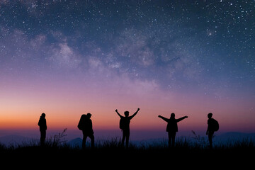 Wall Mural - Silhouette group of young traveler and backpacker watched the star and milky way on top of the mountain with twilight sky. He enjoyed traveling and was successful when he reached the summit.