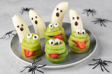Spooky Banana Ghosts Monsters And Green Kiwi Monsters For Halloween Party. Halloween Fruit Serving Idea