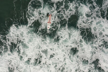Drone View Of A Surf Board In The  Waves 