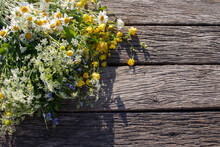 Summer Bouquet Of Wildflowers On Old Wooden Board Background. Midsummer Flowers. Top View, Copy Space 