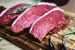 Raw rump steak on cutting board. Red meat, fresh raw beef steak