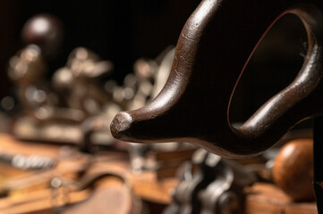 Collection of various antique wood working tools and hand tools in vintage wooden carpenter's tool box