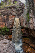Primavera waterfall with its high water flow through the sedimentary rocks at Chapada Diamantina in Lençois town located in Bahia state, Brazil