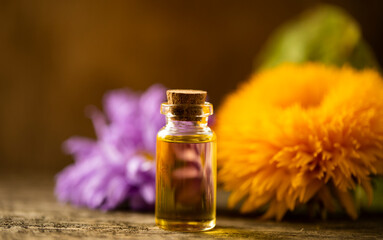 bottle of oil and flower