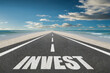 © Jay Koppelman - The word Invest on a beautiful highway motivation concept.