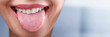 Leinwandbild Motiv Woman Showing Her Tongue