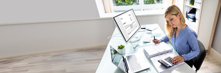 Poster - young businesswoman calculating bill in office